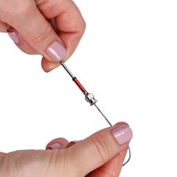 Singer 7-In-1 Punch Needle Set, needled in hand pulling thread tight (thread not included)