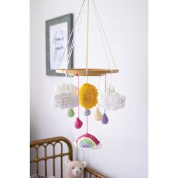 Lion Brand Feels Like Butta Yarn - White, clouds made of yarn hanging from baby mobile