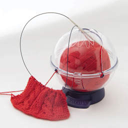 Prym Yarnit Yarn Holder - in use, needles held by yarn holder (materials not included)