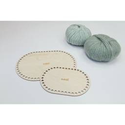 Skacel by Addi Shapes Basket Bases - Pkg of 2, Oval sitting besides yarn
