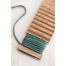 Twig & Horn Wraps Per Inch Tool with yarn wrapped around bottom notch