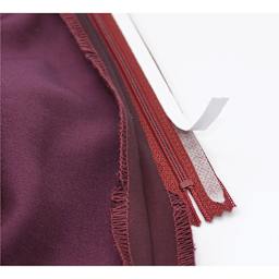 Dritz Wash-A-Way Wonder Tape - Transparent, 1/4" x 10 yds being applied to zipper cloth