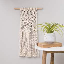 Leisure Arts Macramé Butterfly Kit (Completed macramé butterfly hanging on wall)