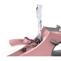 Singer SteamCraft Steam Iron - Pink, filling the water compartment