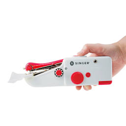 Singer Stitch Sew Quick Handheld Mending Machine being held