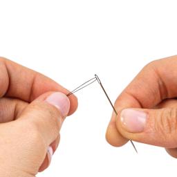 Singer Beginner's Sewing Kit - Set of 130 included needle being threaded