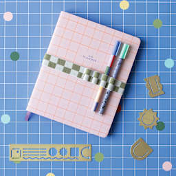 Kikkerland Inkerie Pen Holder Book Band - Green, on notebook