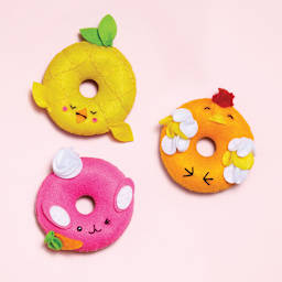 Sew Your Own Donut Animals - Yellow, orange, and pink plush donut creatures