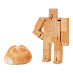 Areaware Cubebot Classic Wooden Figure - Natural, size comparison with pastry