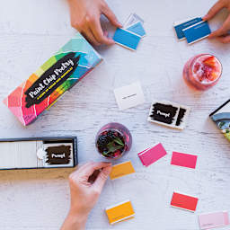 Paint Chip Poetry Game - Overhead view of 2 people playing game