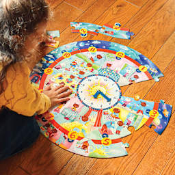 Eeboo Around the Clock 25 Piece Puzzle, child completing puzzle