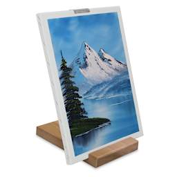 Bob Ross Wooden Travel Easel - Easel set up holding painting
