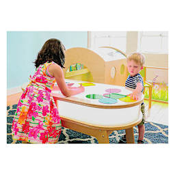 Whitney Brothers Radiant LED Light Table -On, with children playing with brightly colored shapes on table