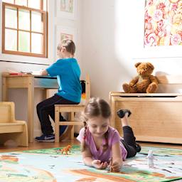 Melissa & Doug Lift Top Desk and Chair - Honey (Model sitting at desk for size reference)