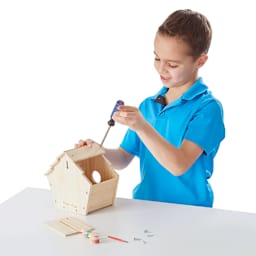 Created by Me Birdhouse Wooden Craft Kit - Child using screwdriver to assemble Birdhouse

