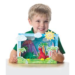 Roylco Set the Scene Diorama Box - Student holding finished Dinosaur Diorama Box