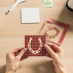 Cricut Coaster Blanks - Person holding completed Horseshoe design square Coaster