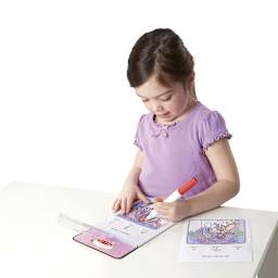 Melissa & Doug On the Go ColorBlast! Activity Book - Child coloring at table
