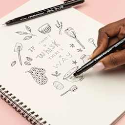 Tombow Mono Drawing Pens - Ultra Fine, Pkg of 2, one pen in hand drawing on paper