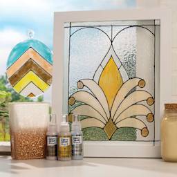 Gallery Glass Paint bottles and decorated window accents.