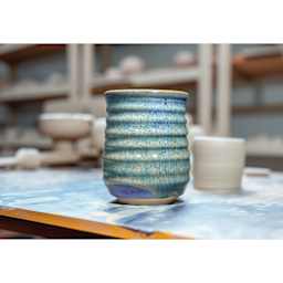 Amaco Dipping and Layering Dry Glaze - Ultramarine, 10 lb, finished pot on desk
