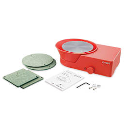 Quark S+ Potter’s Wheel - Red with four bats, an allen key, two bat pins, and a user manual