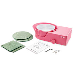 Quark S+ Potter’s Wheel - Pink with four bats, an allen key, two bat pins, and a user manual