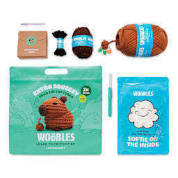 The Woobles Extra Squeezy Crochet Kit - Hugh the Capybara contents with packaging