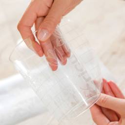 Cricut Transfer Tape Roll applying design to cup