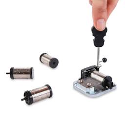 Kikkerland Make Your Own Music Box Kit (Person installing cylinder in soundbox with screwdriver)