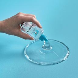 DAP RapidFuse Ultra Clear All Purpose Adhesive - 1.67 oz Bottle being poured out