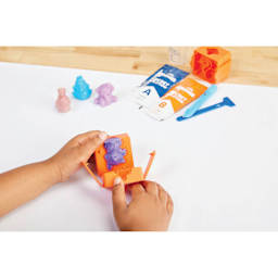 Elmer's Squishies Kit - Mystery Character, Pkg of 2, hand removing character from inside the mold