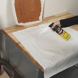 DAP Weldwood Multi-Purpose Spray Adhesive - 11 oz Can being applied to cloth