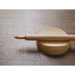 Kakimori Sakura Wood Pen Rest - Japanese Cherry, in use with pen holder on top (not included)
