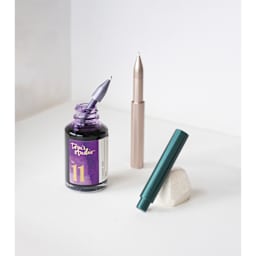 Tom’s Studio Wren Pen Spare Ink Reservoirs - Pkg of 5, Wren pen reservoir being filled on desk