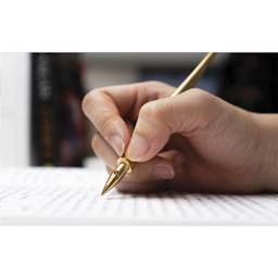 Colorverse Shuttle Dip Pen Nib - Brass, in hand and inserted in nib holder (not included)