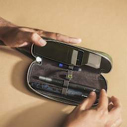 Endless Companion 3 Pen Pouch - Green, hand removing pen from pounch (not included)