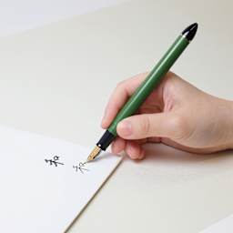 Sailor Fude De Mannen Fountain Pen - Dark Green, 55 Degree Nib, pen in use showing two different strokes