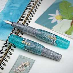 Benu Pixie Fountain Pen - Aqua Glow, two pens laid out (image may show a different size nib)