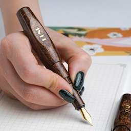 Benu Pixie Fountain Pen - Coffee Brown, pen in hand (image may show a different size nib)