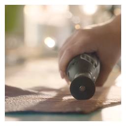 Dremel Lite Cordless Rotary Tool - Closeup of Tool scoring leather