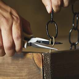 Fiskars Precision Needle-Nose Pliers - Photo showing hand tightening hook with pliers
