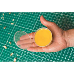 BeaverCraft Natural Beeswax - 2.1 oz Jar held in hand