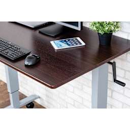 Luxor High Speed Crank Adjustable Stand Up Desk - Dark Walnut with Silver Frame, 48" W - in office, close-up