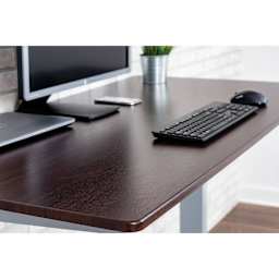 Luxor High Speed Crank Adjustable Stand Up Desk - Dark Walnut with Silver Frame, 59" W - in office, close-up