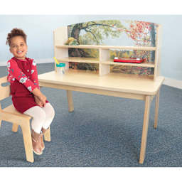 Whitney Brothers Nature View Writing Center, child sitting next to the table