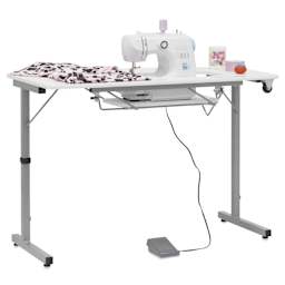Studio Designs Rollaway II Sewing Table - shown with sewing machine and supplies, not included