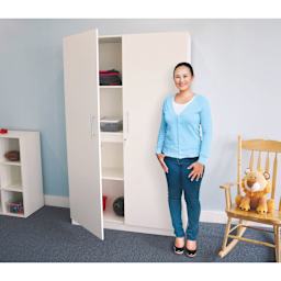 Whitney Brothers White Tall and Wide Wall Cabinet (Woman standing next to cabinet)