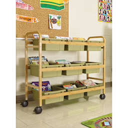 Copernicus Bamboo Book Browser Cart - Sage Green, 9 Bins, infront of a wall