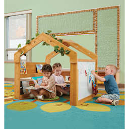 Copernicus Kids Cozy Space, children reading inside, and writing on whiteboard outside of the space